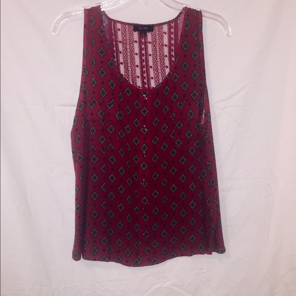 Sleeveless Red Blouse.